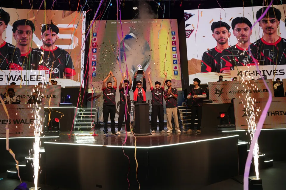 4Thrives Walee lift the trophy on stage at the 2026 PMGO South Asia Finals Season 2 in Kathmandu, amid confetti and sparklers